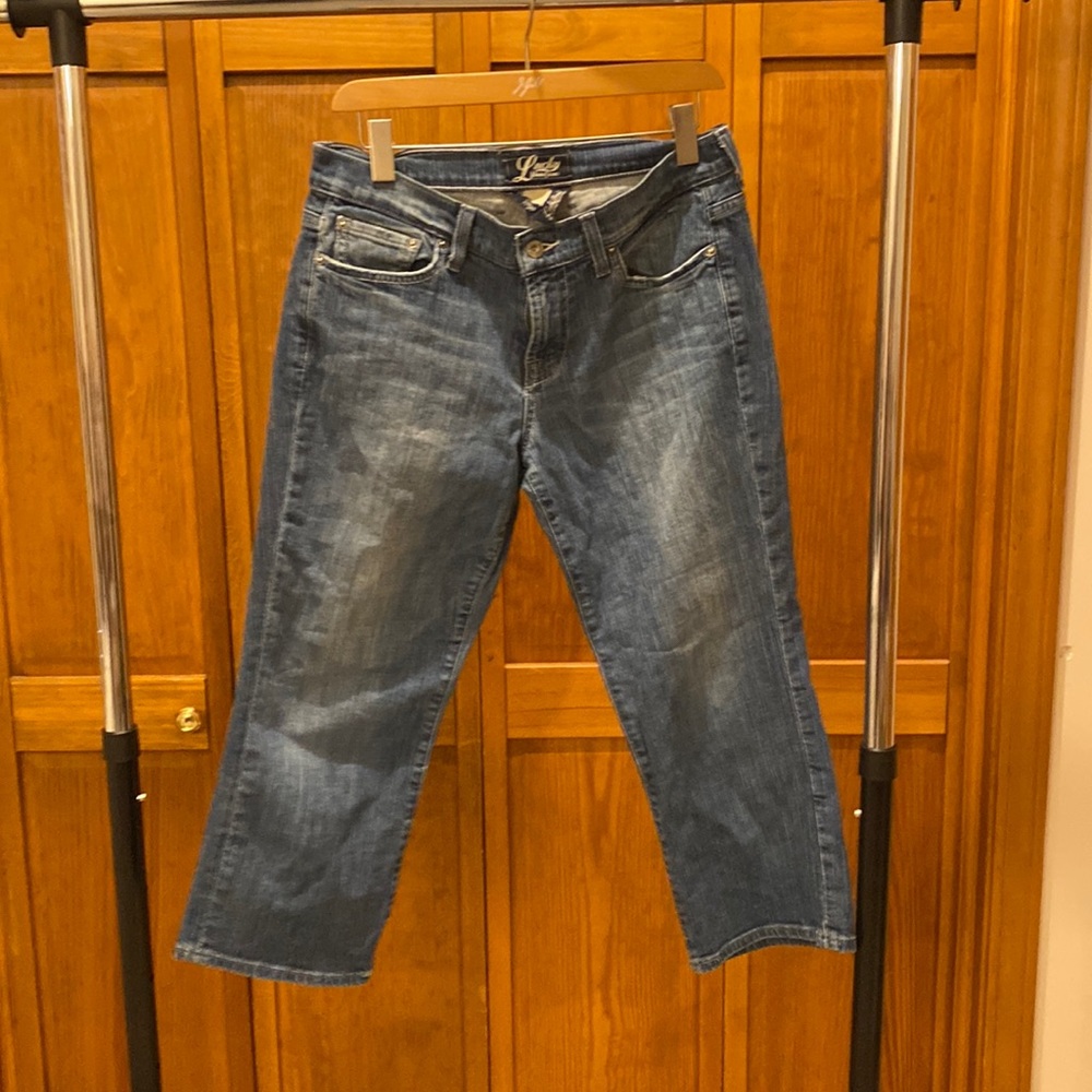 Lucky brand. Slightly distressed wide leg ankle length jeans. Size 8/29.